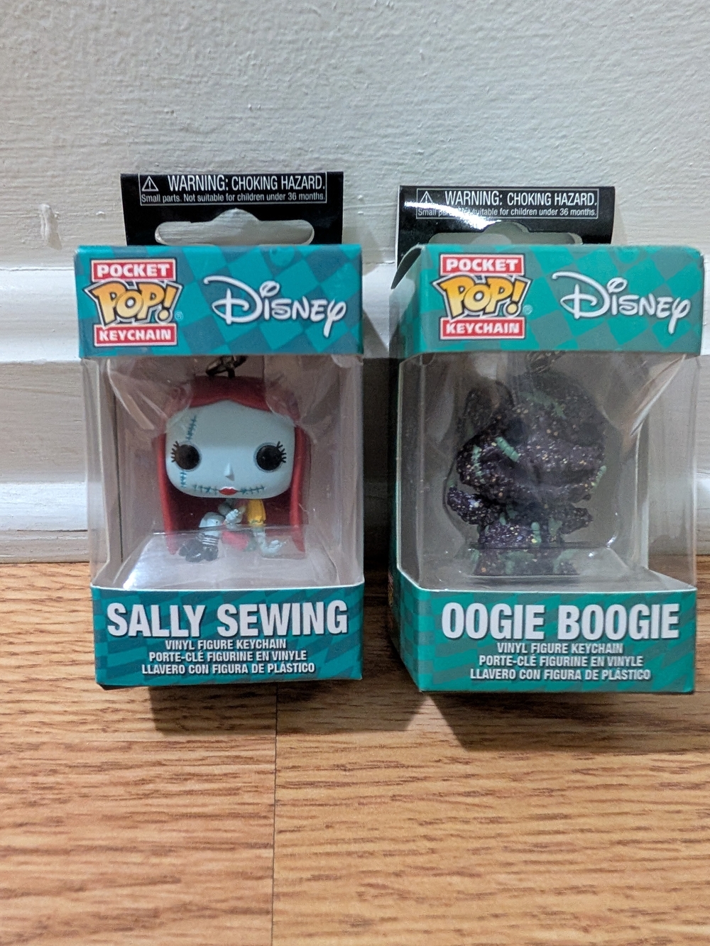 Disney Pocket Pop! Keychain - Sally Sewing (Blue) & Oogie Boogie (Black)